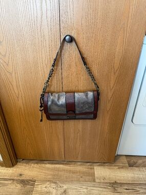 Vintage Fossil Reissue (VRI) flap shoulder bag featuring two tone, blue/gray